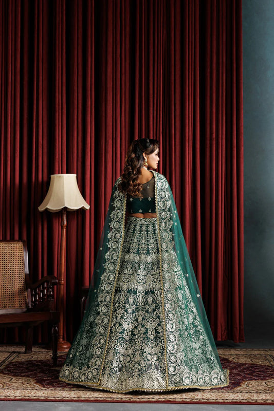 Beautiful net embroidered lehenga with hand embellished panels & sleeves. Includes net dupatta, organza belt, and 6 yards Russian grip inner fabric.