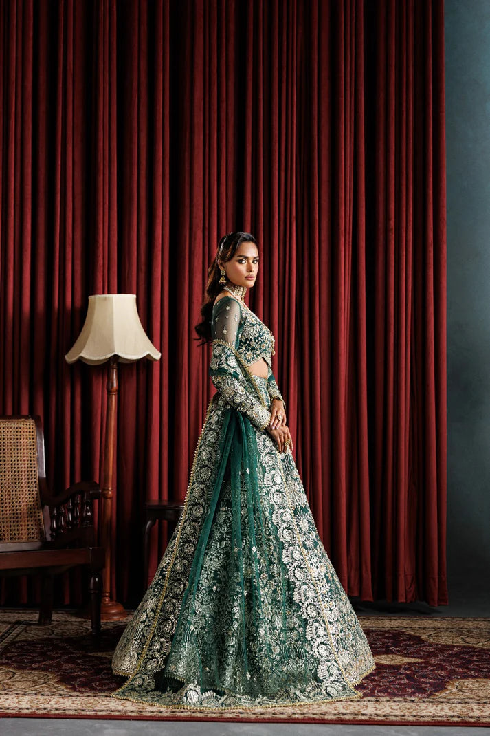 Beautiful net embroidered lehenga with hand embellished panels & sleeves. Includes net dupatta, organza belt, and 6 yards Russian grip inner fabric.