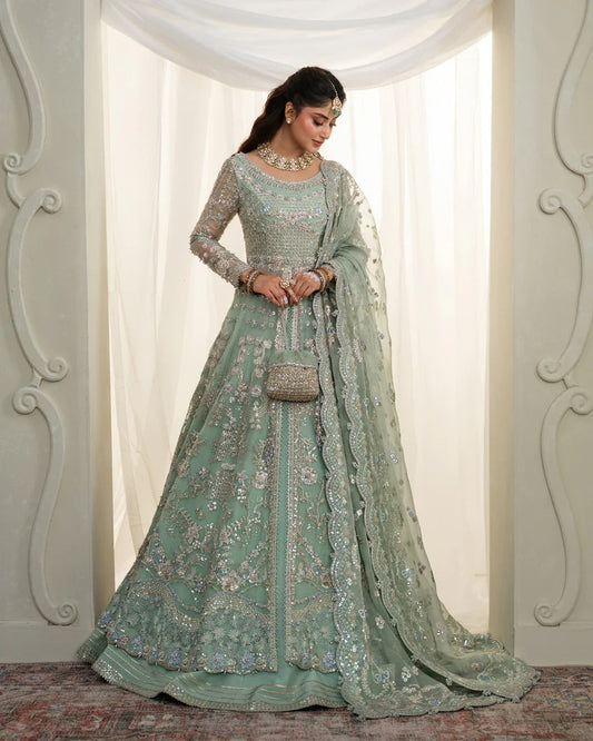 Selin lehenga set in mint green organza with heritage embroidery, paired with raw silk skirt and embroidered dupatta—perfect for weddings and festive celebrations.