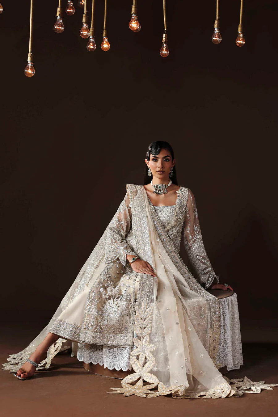 Shop organza embroidered dress with hand embellishments, raw silk trousers & dupatta. Features 3D floral details—perfect for weddings & festive wear.