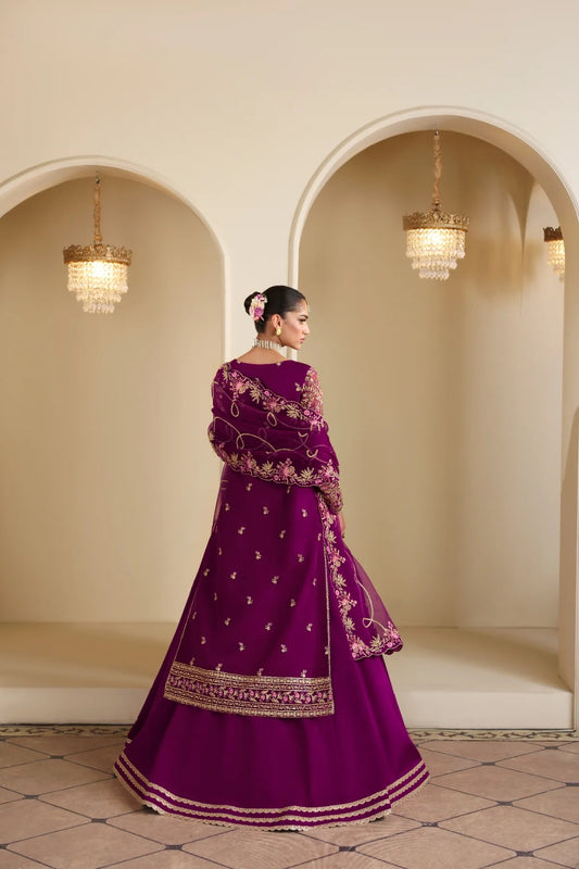 Elegant organza outfit featuring hand-embellished panels, sleeves, silk neckline, and dupatta. Includes detailed borders, Russian grip inner, and silk trouser.