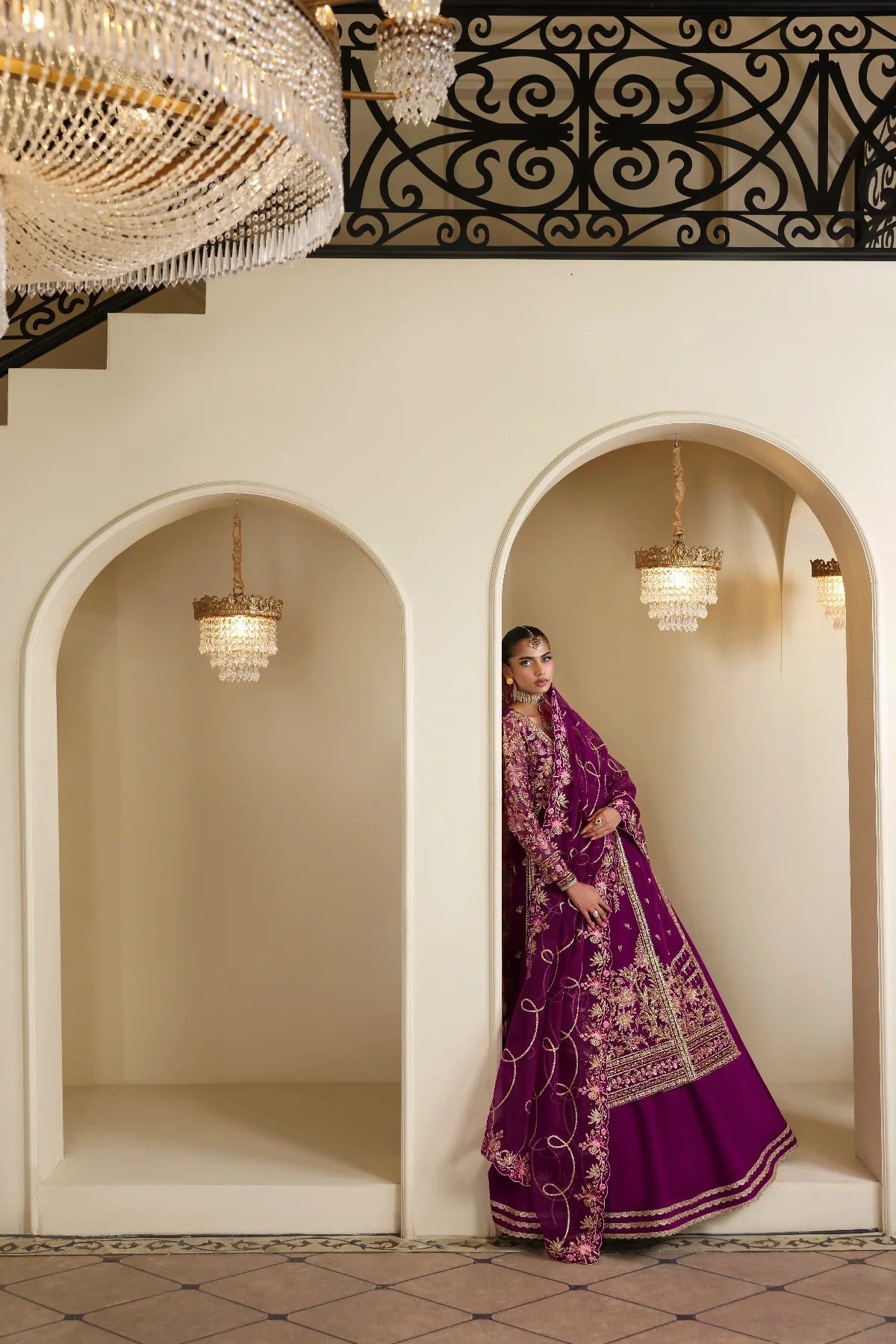 Elegant organza outfit featuring hand-embellished panels, sleeves, silk neckline, and dupatta. Includes detailed borders, Russian grip inner, and silk trouser.