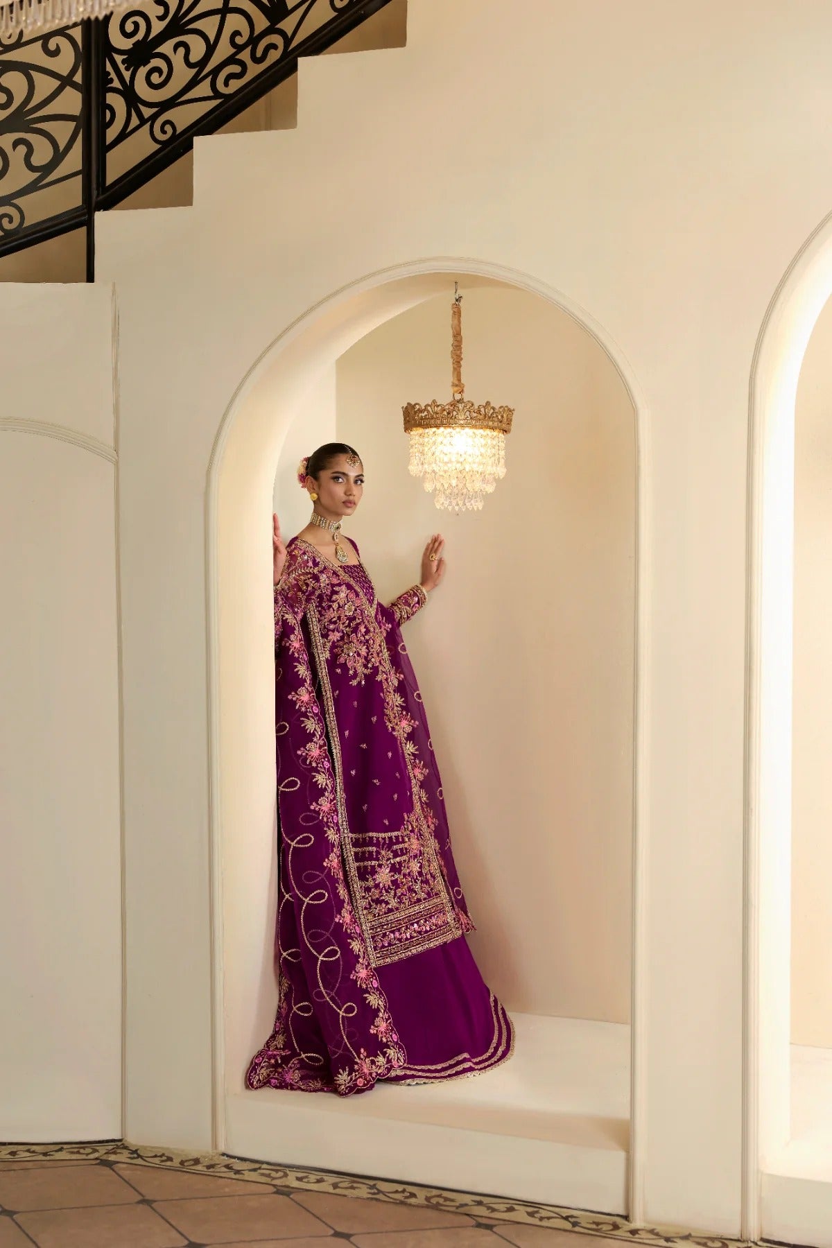 Elegant organza outfit featuring hand-embellished panels, sleeves, silk neckline, and dupatta. Includes detailed borders, Russian grip inner, and silk trouser.