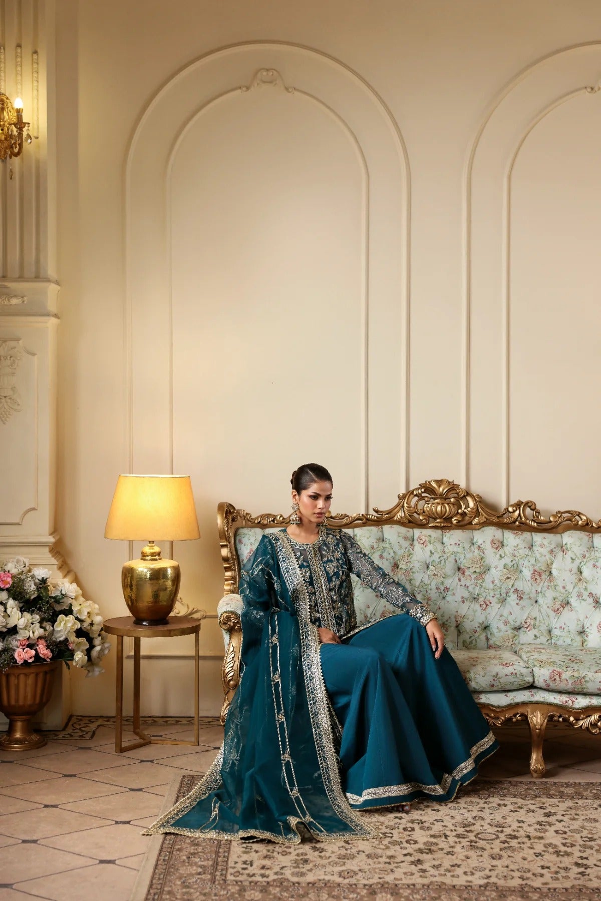 Refined organza dress with hand-embellished panels, sleeves, and borders. Includes embroidered dupatta, Russian grip inner, and raw silk trouser fabric.