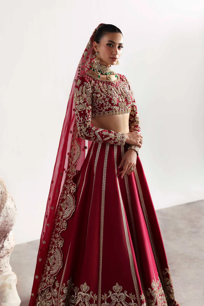Elegant silk ensemble featuring hand-embellished front and body panels, embroidered sleeves, detailed organza neckline, and a matching embroidered dupatta.