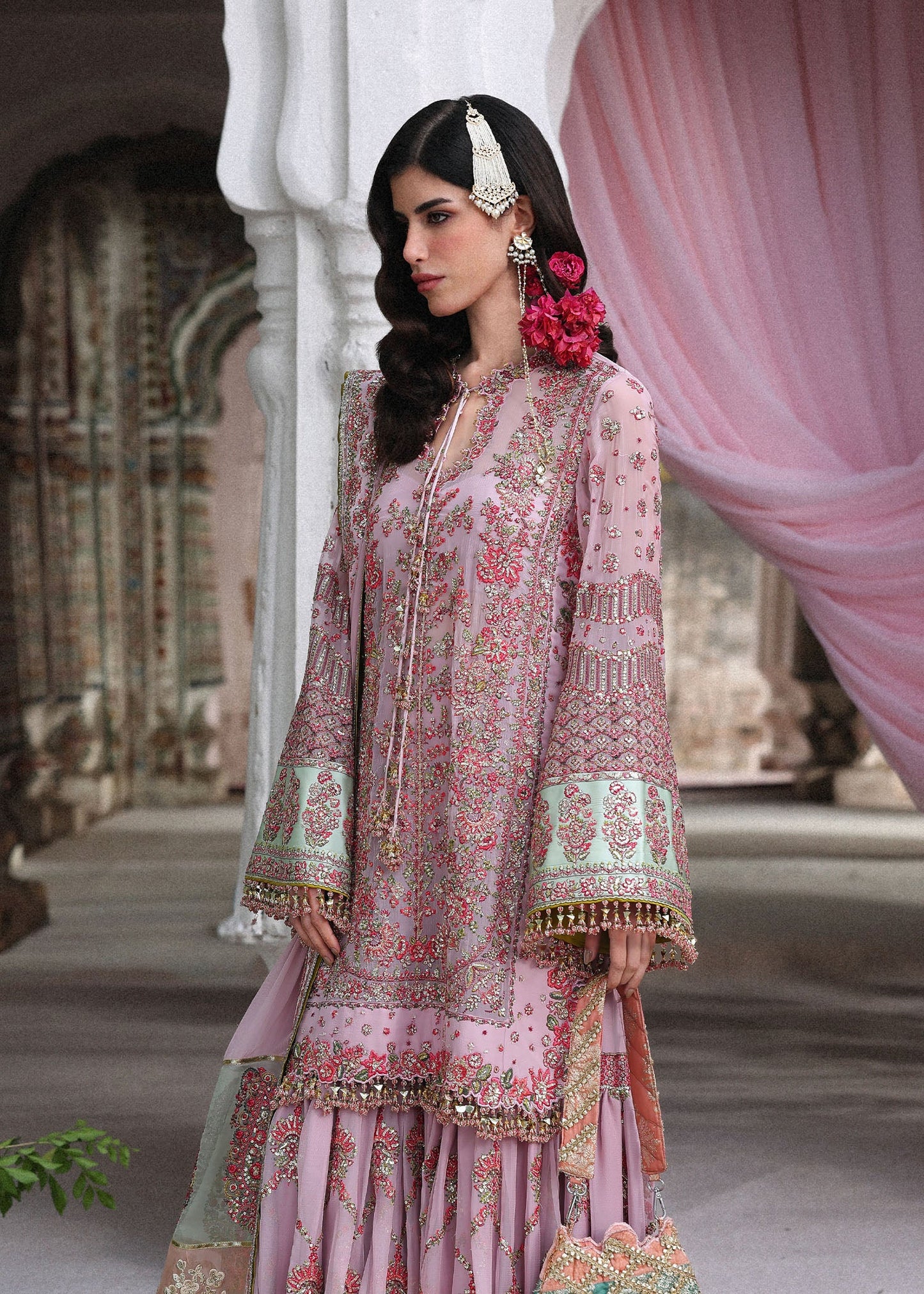Elegant lilac chiffon ensemble with embroidered short shirt, flowing gharara and chiffon dupatta featuring organza pallu and four-sided borders for festive occasions.
