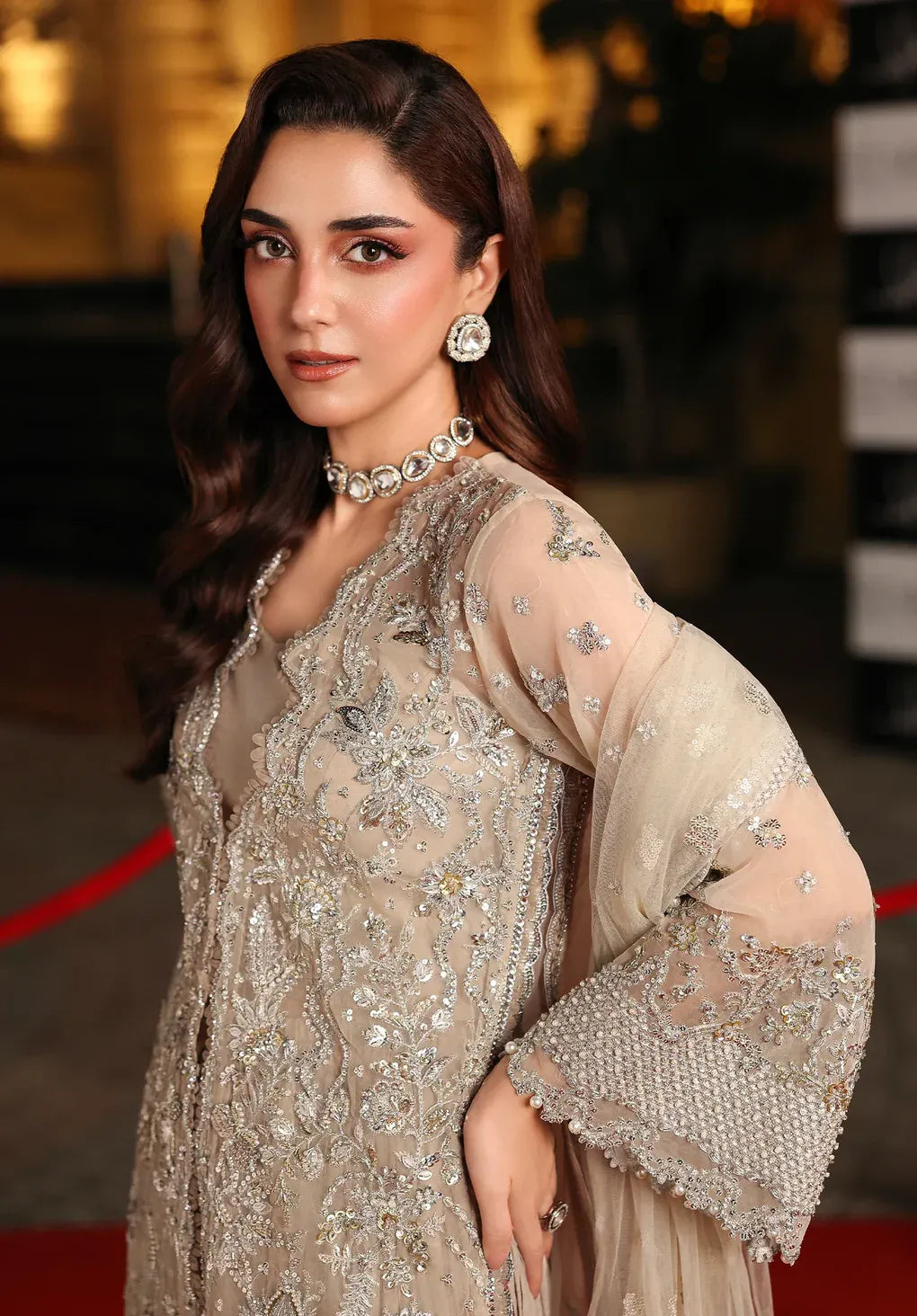 Stardust by Elaf Stardom ’25 features hand-embroidered organza panels, embroidered poly-net dupatta, and raw silk inner — ideal for festive and formal elegance.