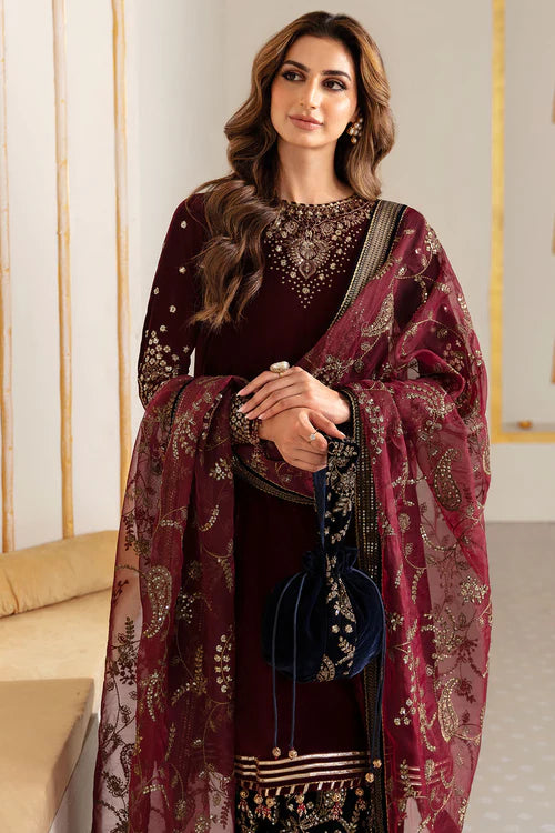 Elegant pure velvet dress with embroidered front, sleeves, and trouser. Paired with organza dupatta for a luxurious and graceful formal look.