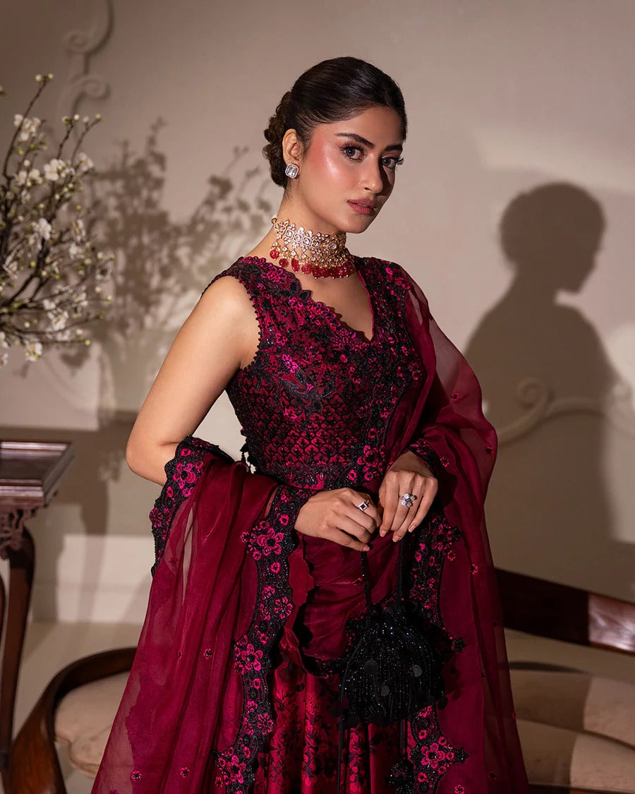 Havin set in dark magenta shamose silk with printed and embroidered shirt, paired with embroidered organza/net dupatta and silk trousers—perfect for festive occasions.