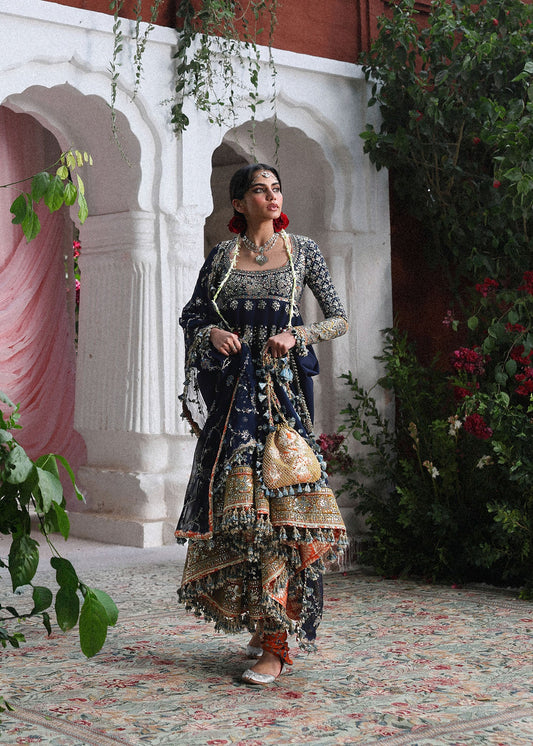 Elegant navy blue Korean raw silk pishwas with embroidered panels and sleeves, paired with printed chooridar and chiffon dupatta with four-sided borders.