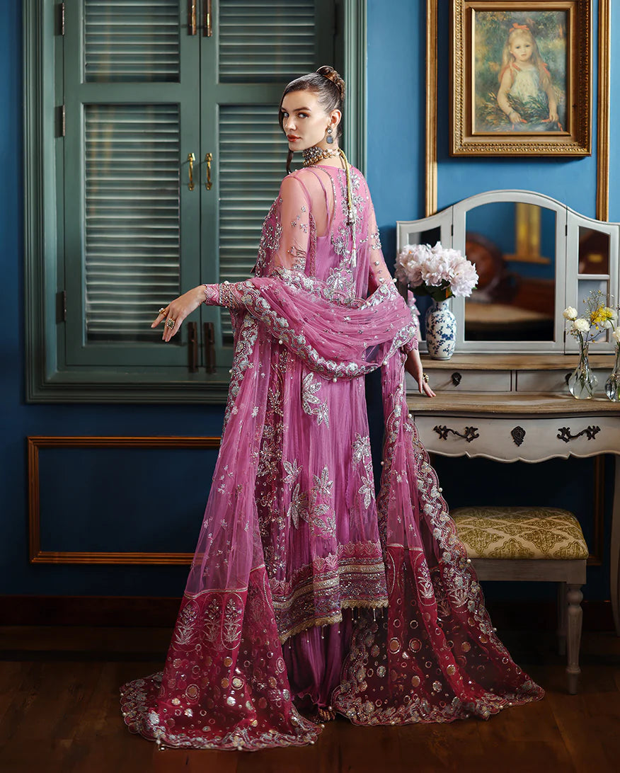 Elegant hand-embellished net shirt with sequins, pearls & organza, paired with dyed silk lehenga. Perfect for festive & bridal occasions.