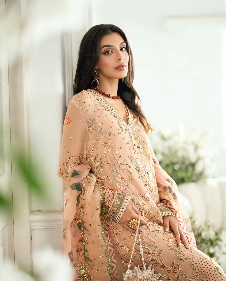 Elegant mocha chiffon suit with handwork, 3D florals, printed organza dupatta & foil silk trouser. Finished with tassels, lace & pearl detailing. Shop now!
