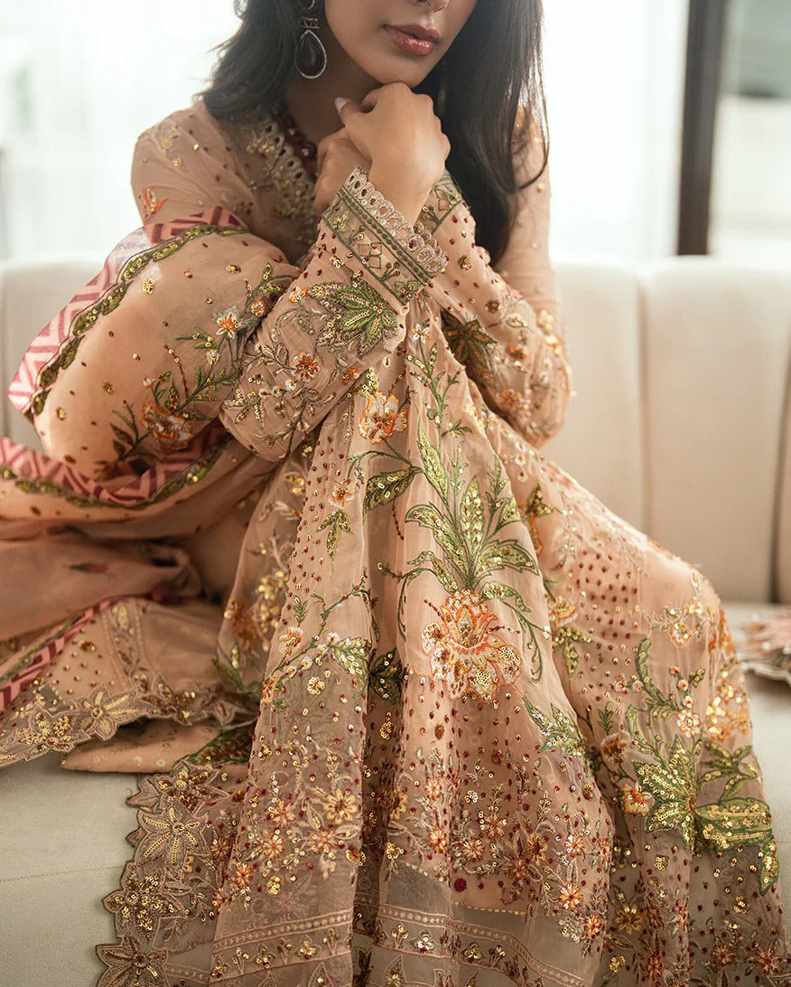 Elegant mocha chiffon suit with handwork, 3D florals, printed organza dupatta & foil silk trouser. Finished with tassels, lace & pearl detailing. Shop now!