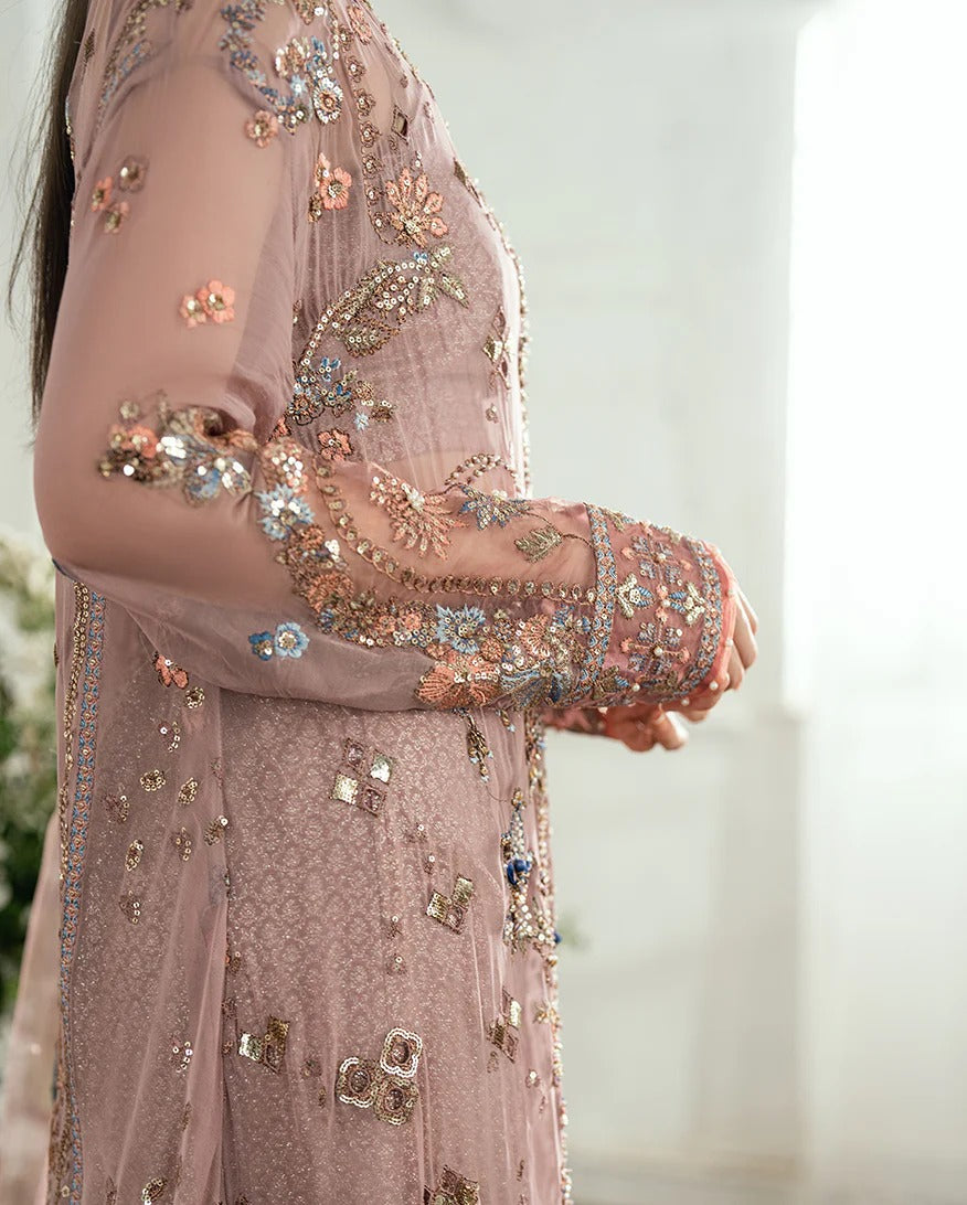 Luxury chiffon lehenga outfit with hand embellishments, sequins & pearl-detailed net dupatta. Includes jamawar lehenga & handcrafted tassels. Shop now!