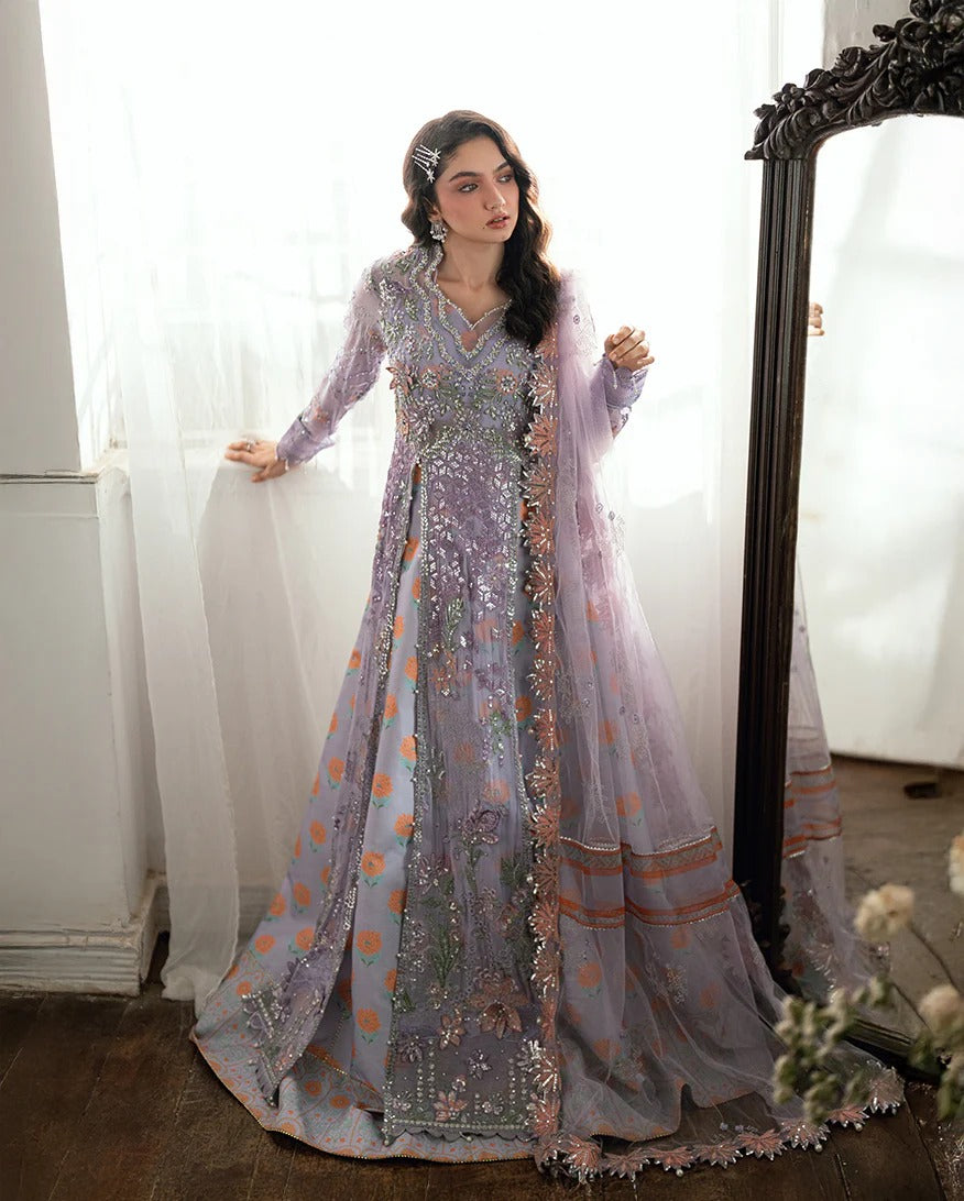 Shop this chiffon suit with hand embellishments, 3D florals, sequinned net dupatta & printed silk trouser. Includes tassels, lace & pearl detailing.