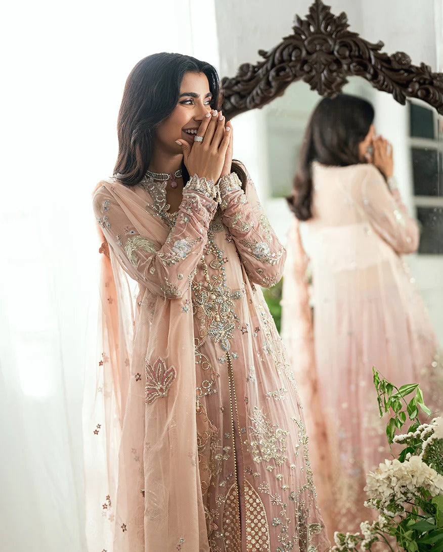 Luxurious chiffon suit with pearl & sequin work, foil printed silk trouser, and 3D floral organza dupatta. Includes tassels, zari & handcrafted finishes.