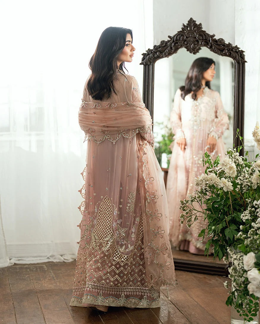 Luxurious chiffon suit with pearl & sequin work, foil printed silk trouser, and 3D floral organza dupatta. Includes tassels, zari & handcrafted finishes.