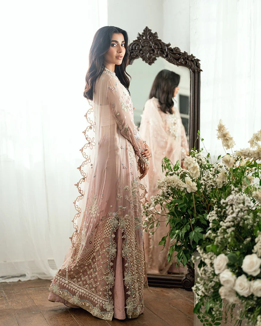 Luxurious chiffon suit with pearl & sequin work, foil printed silk trouser, and 3D floral organza dupatta. Includes tassels, zari & handcrafted finishes.