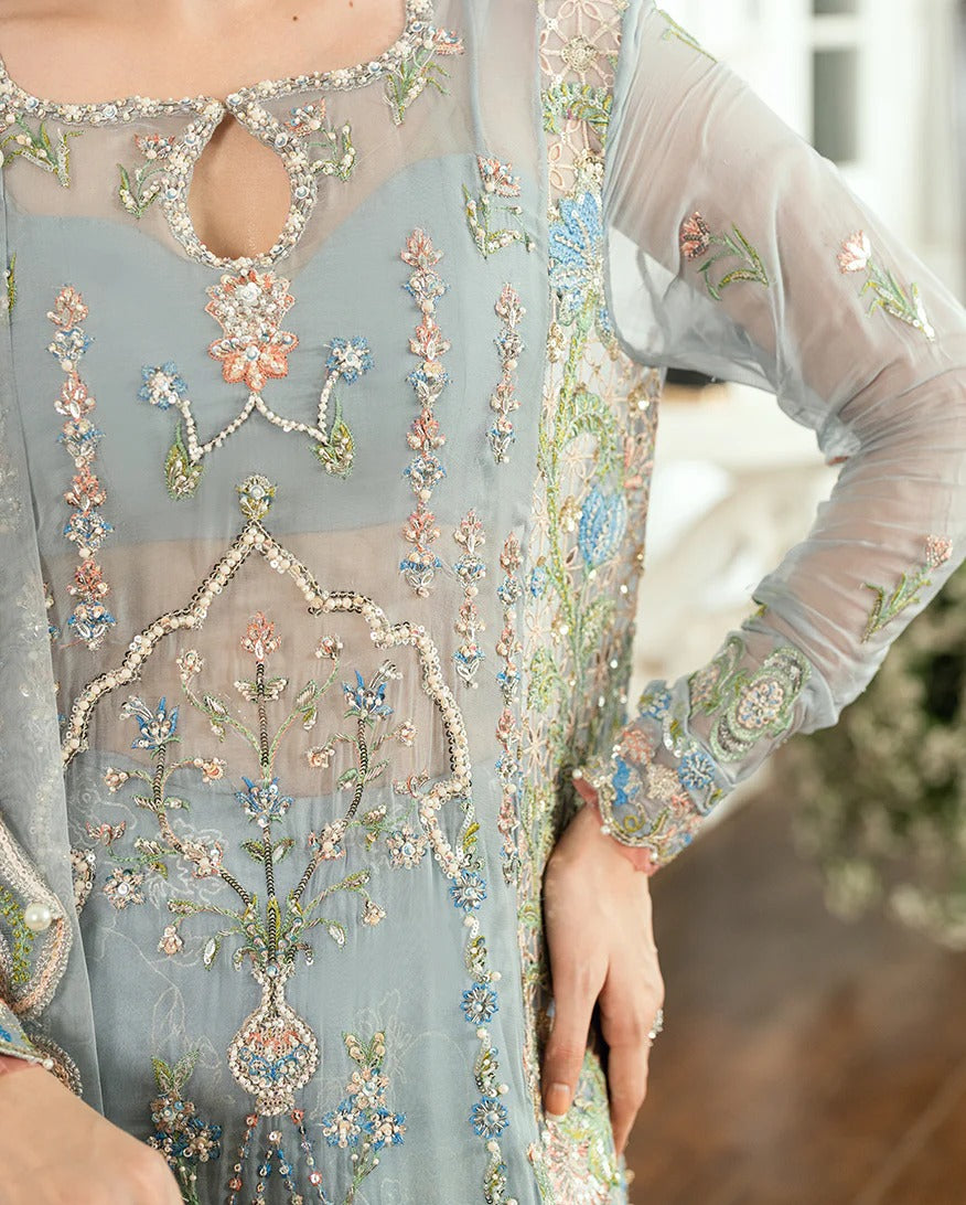 Shop this ice blue chiffon suit with pearl & sequin work, sequinned net dupatta, foil silk trouser & handcrafted tassels. Perfect for festive & formal occasions!