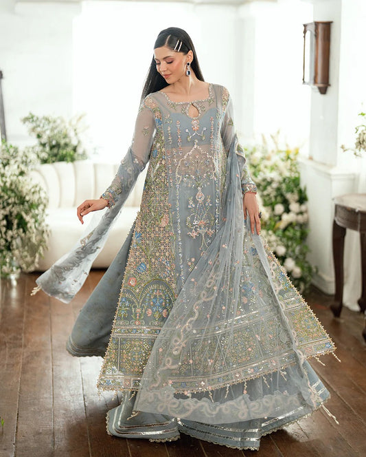 Shop this ice blue chiffon suit with pearl & sequin work, sequinned net dupatta, foil silk trouser & handcrafted tassels. Perfect for festive & formal occasions!
