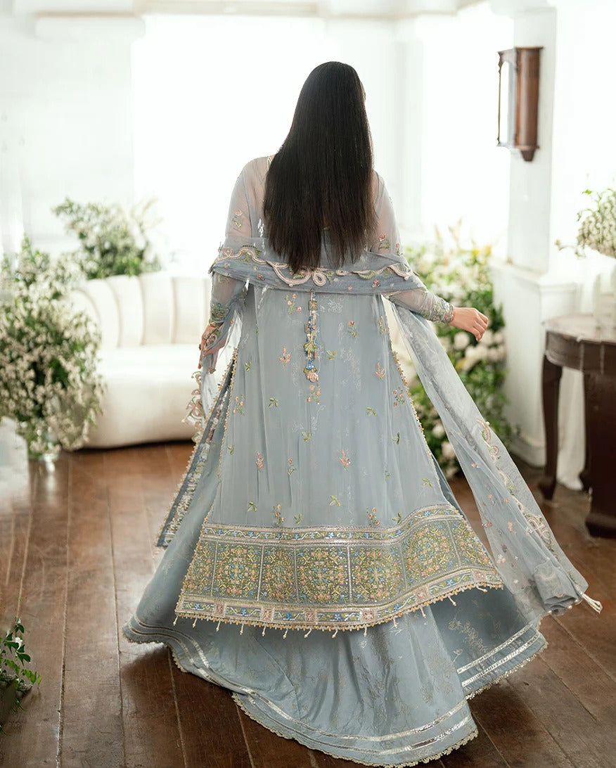 Shop this ice blue chiffon suit with pearl & sequin work, sequinned net dupatta, foil silk trouser & handcrafted tassels. Perfect for festive & formal occasions!