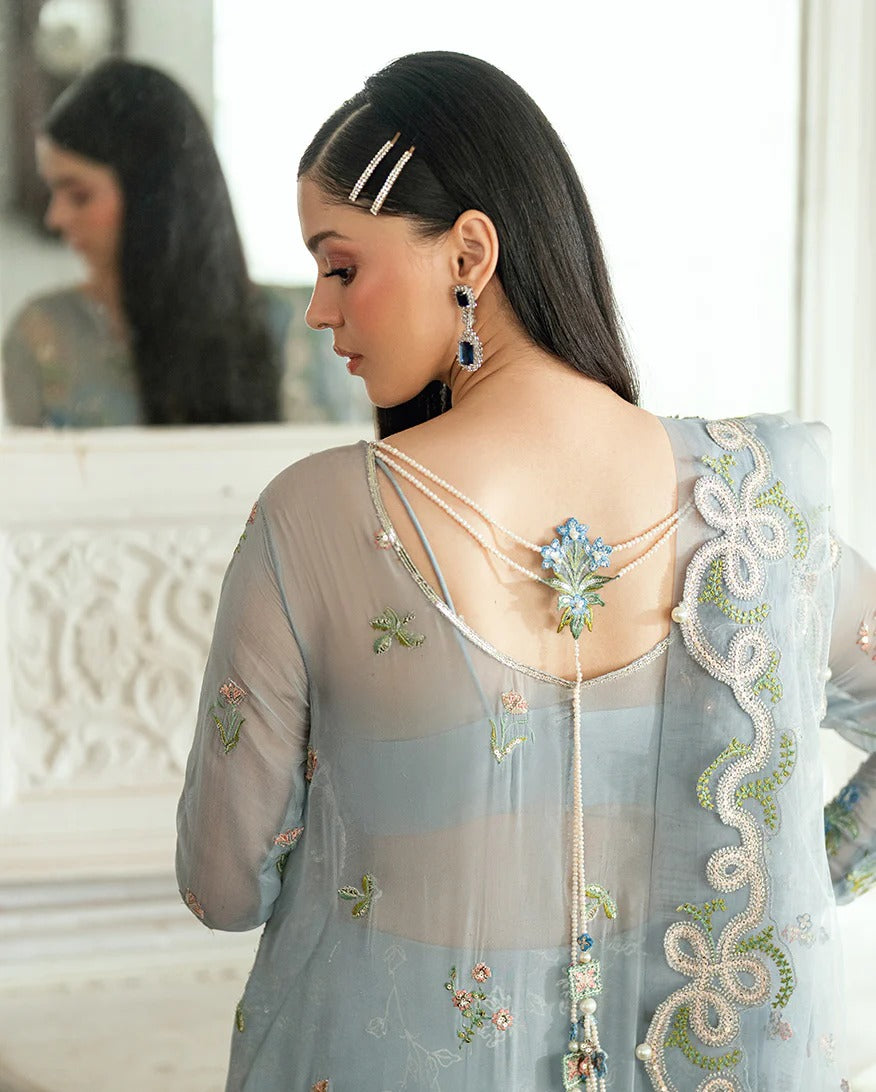 Shop this ice blue chiffon suit with pearl & sequin work, sequinned net dupatta, foil silk trouser & handcrafted tassels. Perfect for festive & formal occasions!