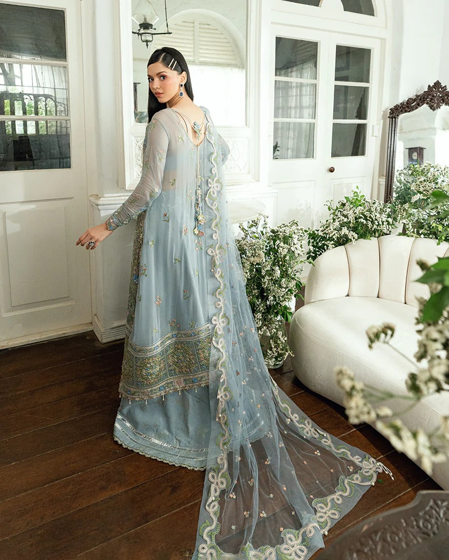 Shop this ice blue chiffon suit with pearl & sequin work, sequinned net dupatta, foil silk trouser & handcrafted tassels. Perfect for festive & formal occasions!