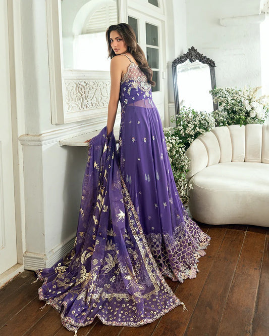 Graceful purple chiffon suit with hand embellishments, 3D daman lace, foil printed dupatta & raw silk trousers. Finished with tassels, pearls & tila lace.