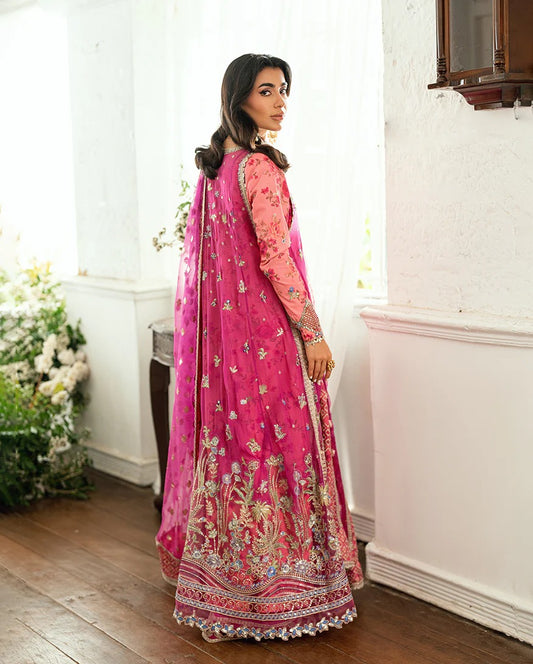 Shop this shocking pink chiffon suit with silk sleeves, lurex dupatta & raw silk trouser. Hand embellishments, sequins & tassels add a luxe festive finish!