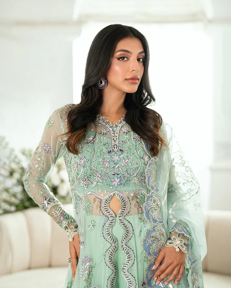 Elegant aqua chiffon suit with printed panels, sequinned organza borders, foil dupatta & raw silk trouser or jamawar lehenga. Finished with pearls & lace.