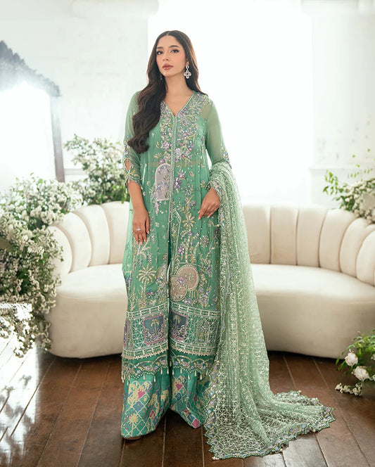 Shop this sea green chiffon suit with hand embellishments, sequinned net dupatta, raw silk trousers, and handcrafted tassels. Perfect for festive occasions!