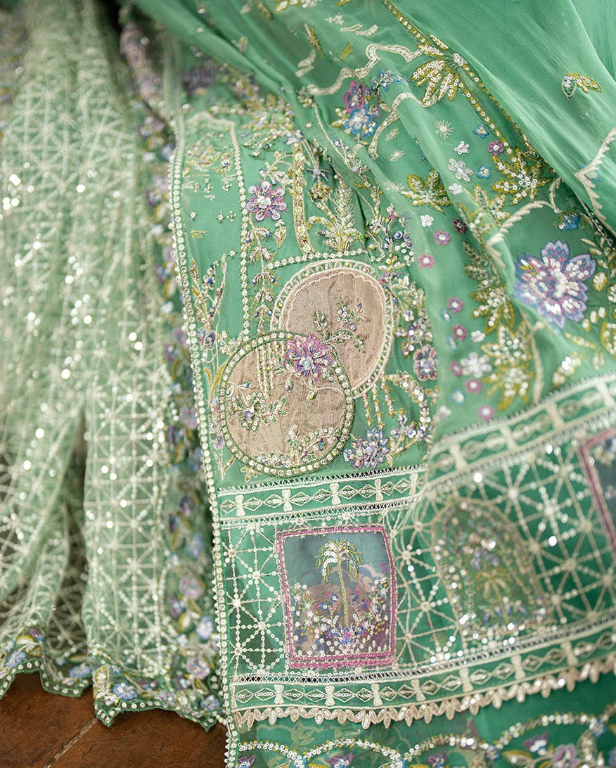 Shop this sea green chiffon suit with hand embellishments, sequinned net dupatta, raw silk trousers, and handcrafted tassels. Perfect for festive occasions!