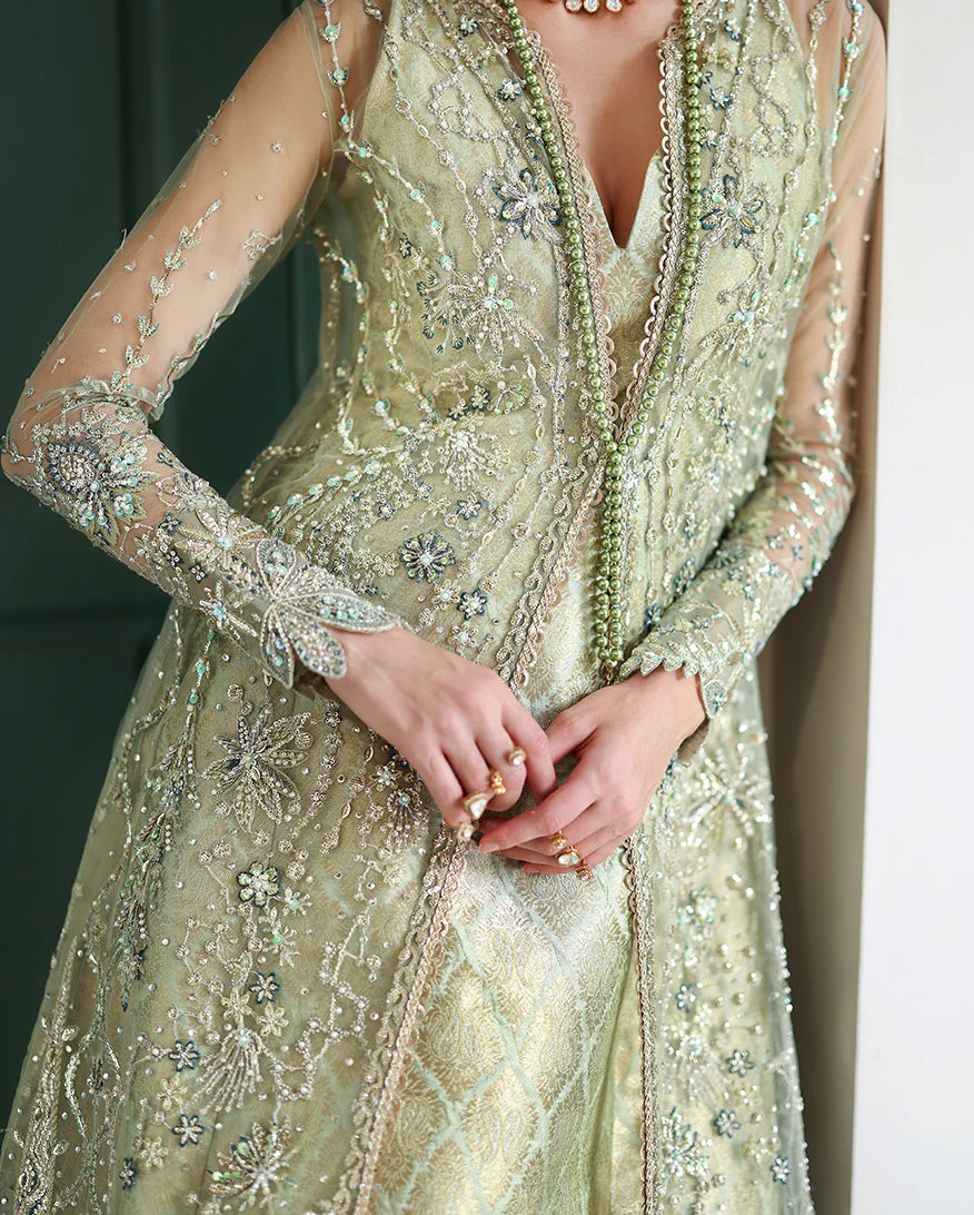 Elegant hand-embroidered net shirt with sequins & organza, paired with dyed jamawar lehenga. Perfect for weddings, festive, and special occasions.