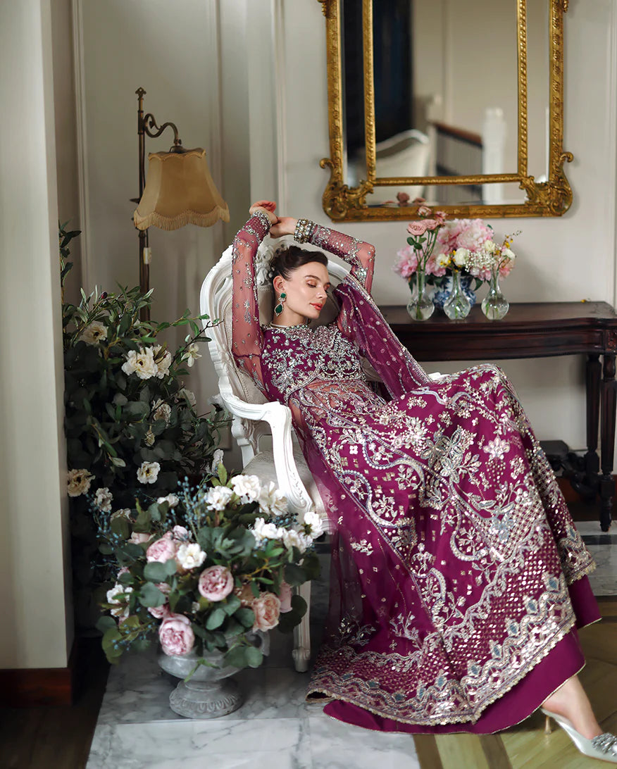 Hand-embellished embroidered net shirt with sequins and pearls, paired with a dyed raw silk lehenga and embroidered net dupatta—perfect for weddings and festive wear.