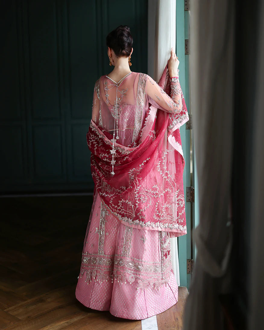 Elegant hand-embroidered net shirt with sequins & organza, paired with dyed jamawar lehenga. Ideal for weddings, festive, & special occasions.