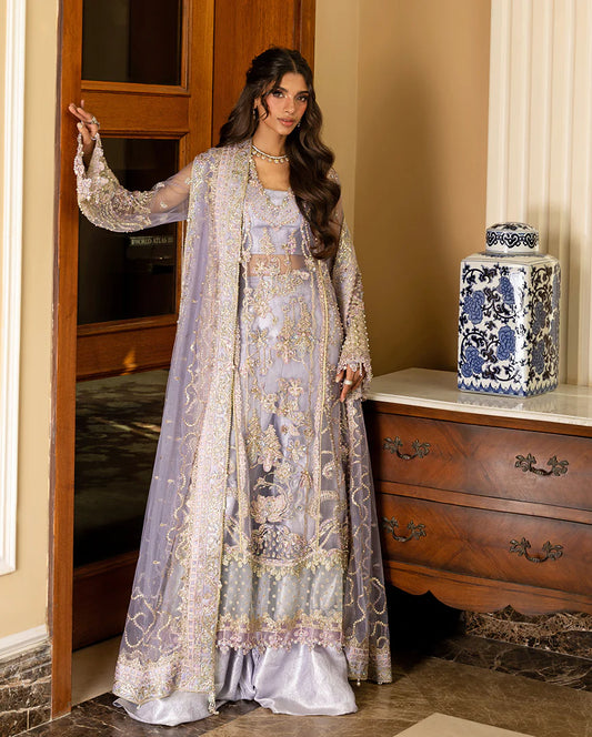 Luxury wedding formal featuring hand-embroidered sequined net shirt, organza daman borders, sequined dupatta, and dyed jamawar lehenga with pearl finishes.