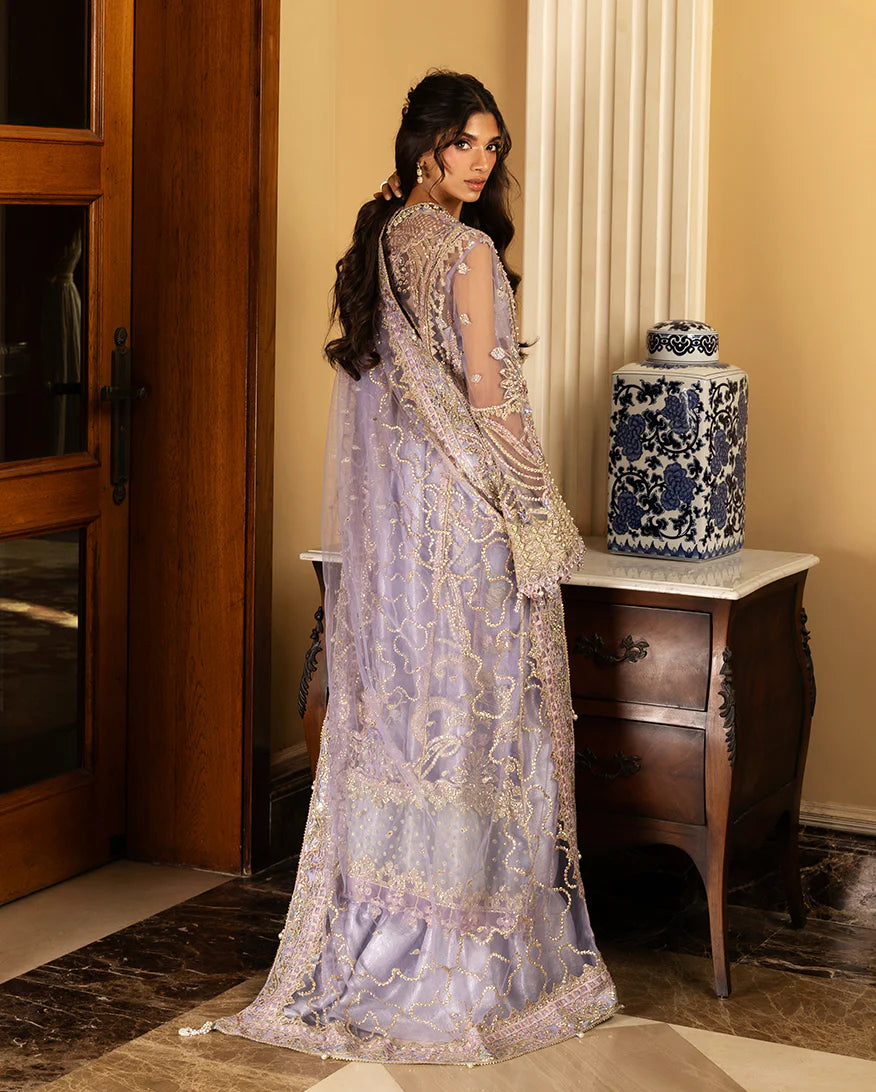 Luxury wedding formal featuring hand-embroidered sequined net shirt, organza daman borders, sequined dupatta, and dyed jamawar lehenga with pearl finishes.