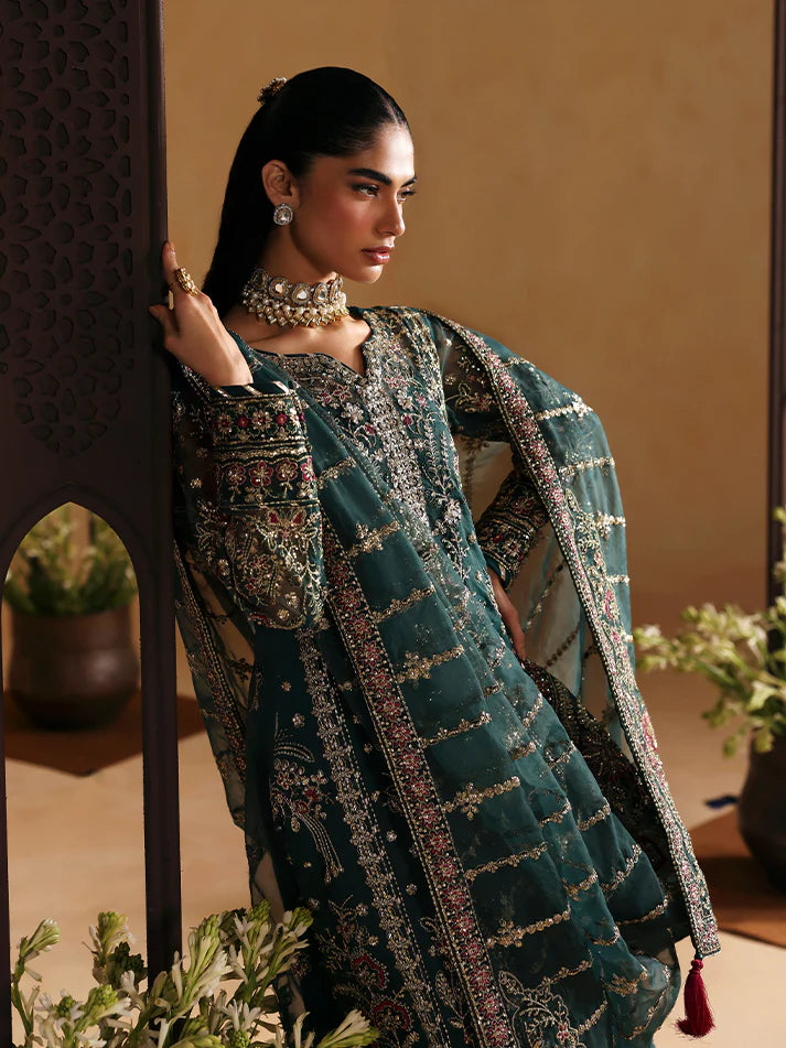 Elegant organza shirt set featuring sequined panels, embroidered borders and sleeves, linear dupatta with motifs, and a rich raw silk sharara ensemble.