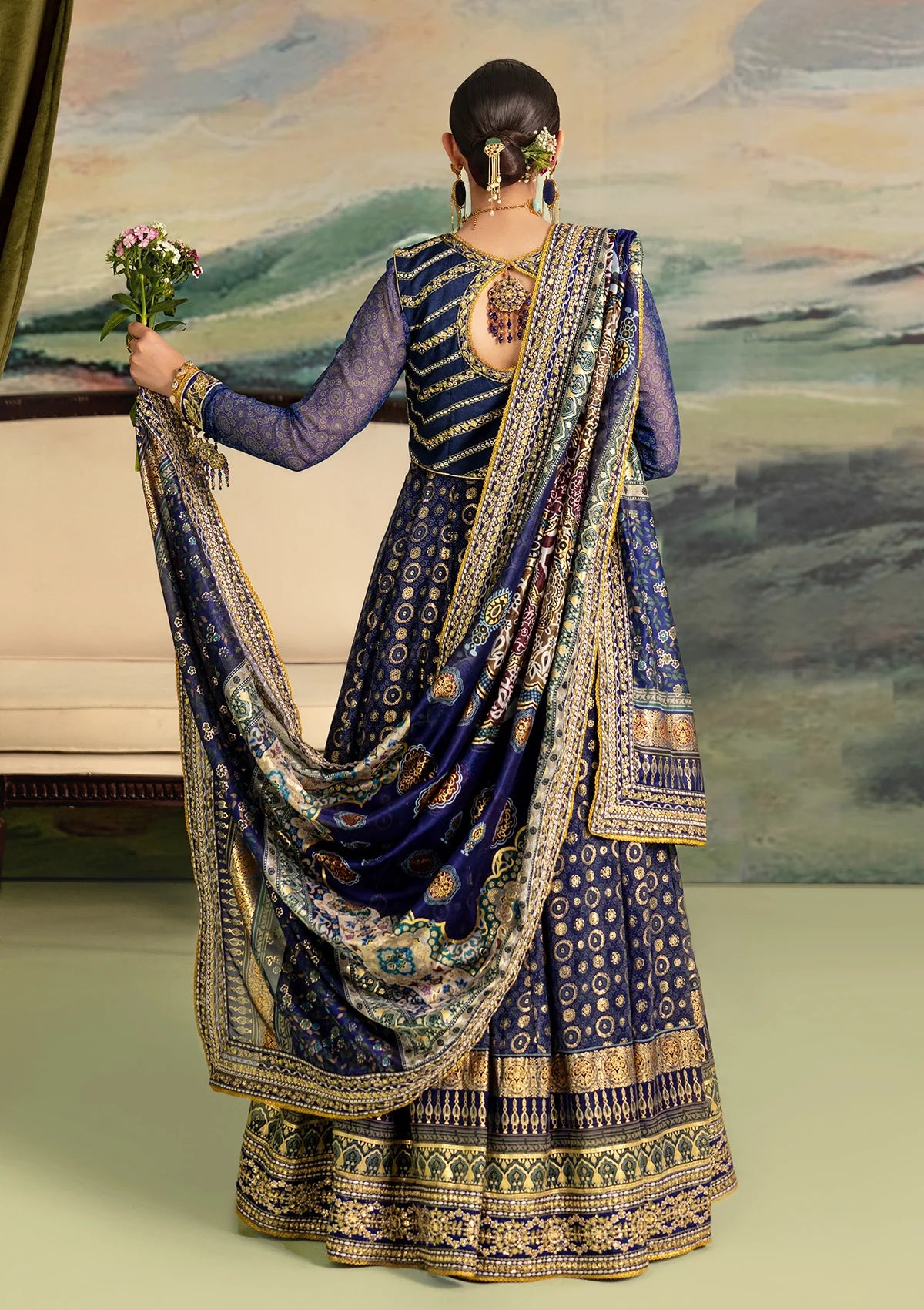 Elegant printed chiffon dress with embroidered silk bodice patches, organza borders and sleeves. Paired with medium silk pants and foil printed silk dupatta.
