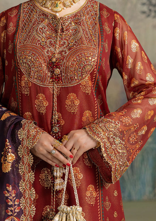 Elegant foil printed chiffon dress with embroidered organza neckline, borders and sleeves. Paired with masoori silk pants and foil printed silk dupatta.