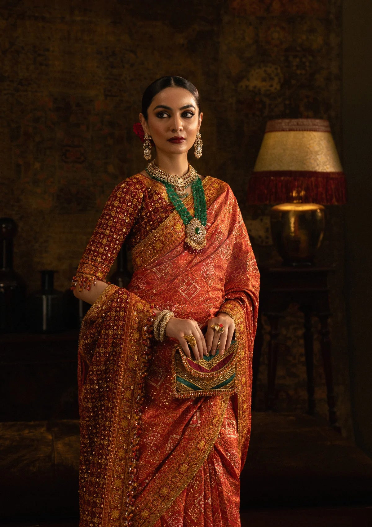 Elegant medium silk blouse with embroidered front, back, and sleeves, paired with printed and embroidered tussar silk saree featuring pallu, borders, and silk petticoat for festive occasions.