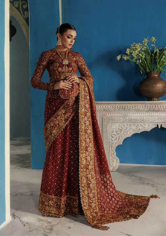 Elegant embroidered velvet blouse with organza detailing paired with chiffon saree featuring embroidered pallu, borders, and medium silk petticoat for festive wear.