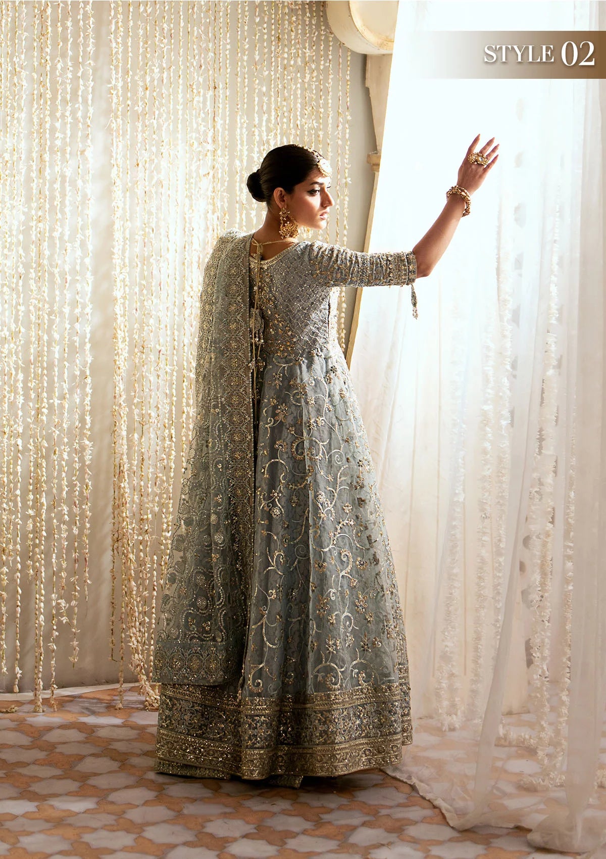Elegant embroidered organza ensemble with embellished bodice, delicate motifs, jamawaar pants, and an embroidered net dupatta. Styled as open front frock with crushed skirt or kalidaar frock with palazzo.