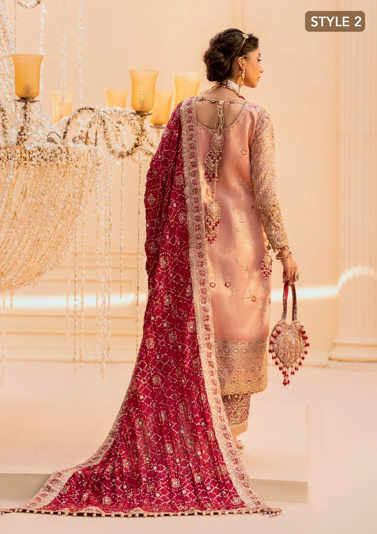 Elegant tissue ensemble with rich embroidery, embellished borders, jamawaar pants, and a silk dupatta. Styled as a long shirt with gharara or izaar pants.