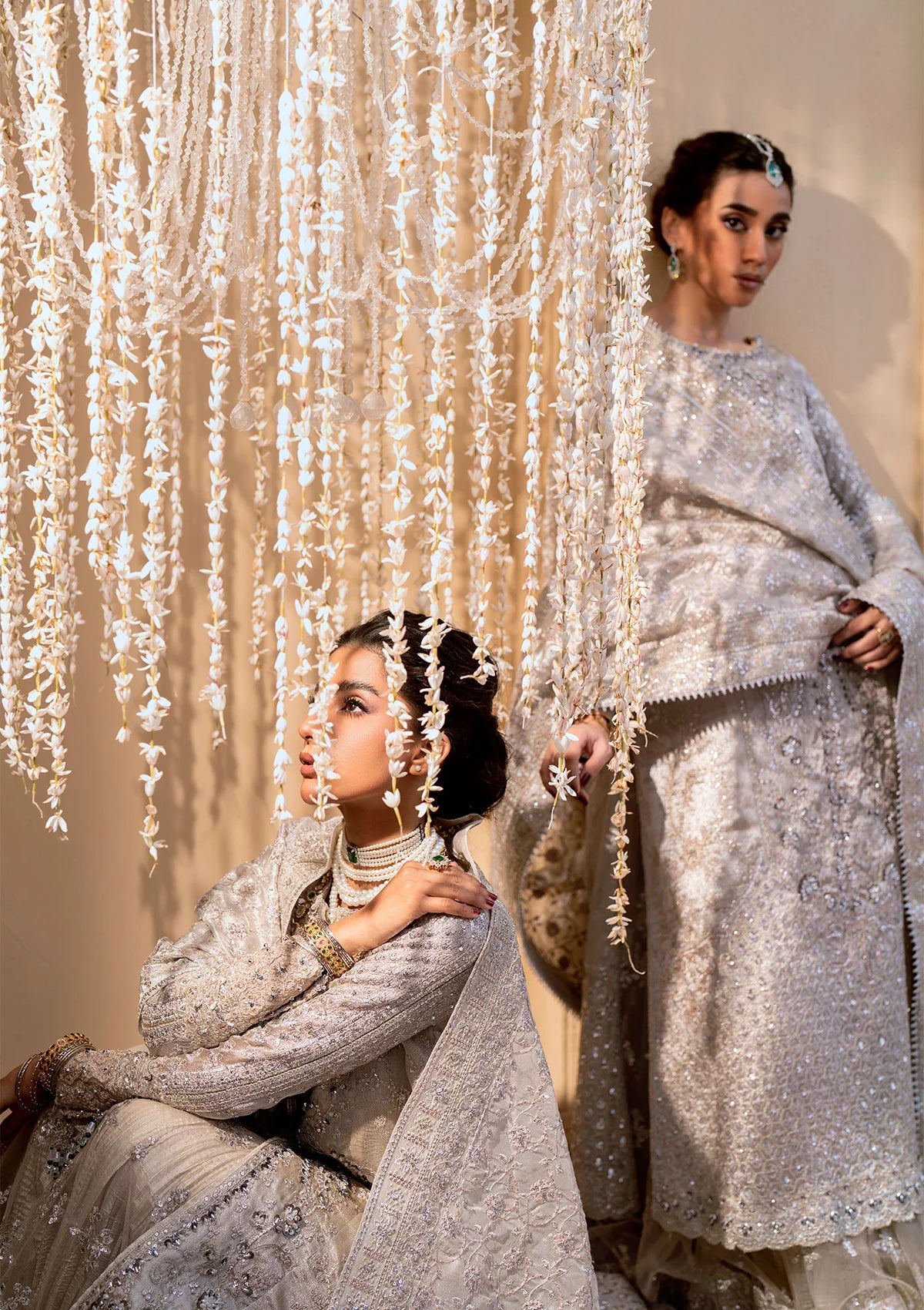 Opulent kundan zari ensemble with embellished panels, intricate jaal work, tissue borders, masoori silk pants, and an embroidered tissue dupatta. Styled as open-front shirt with crushed skirt or side-slit open shirt with crushed frock.