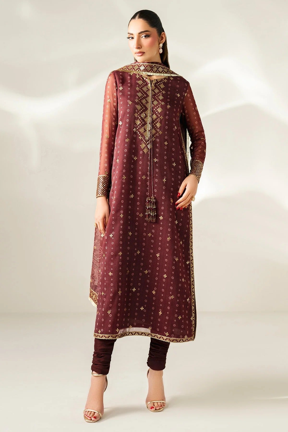Digitally printed chiffon with intricate embroidery, bordered dupatta, and dyed raw silk bottom—perfect for weddings, festive events, or formal wear.