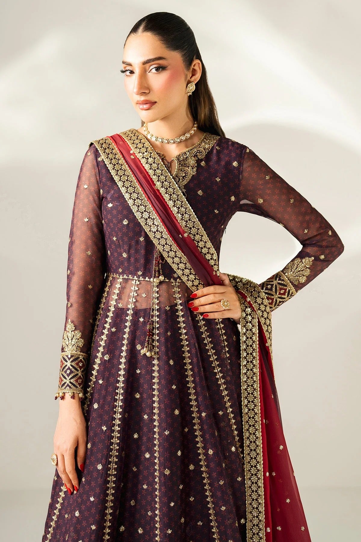 Intricately embroidered chiffon suit with digital prints, bordered dupatta, and raw silk bottom—crafted for timeless elegance and formal sophistication.