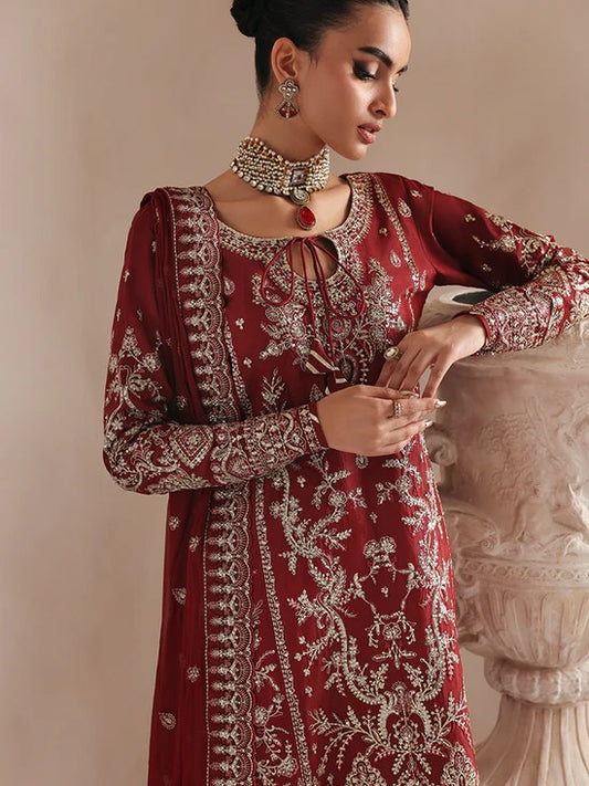 Elegant raw silk dress featuring intricate embroidered and sequined panels, borders, and chiffon dupatta. Includes organza accents and dyed silk trouser.