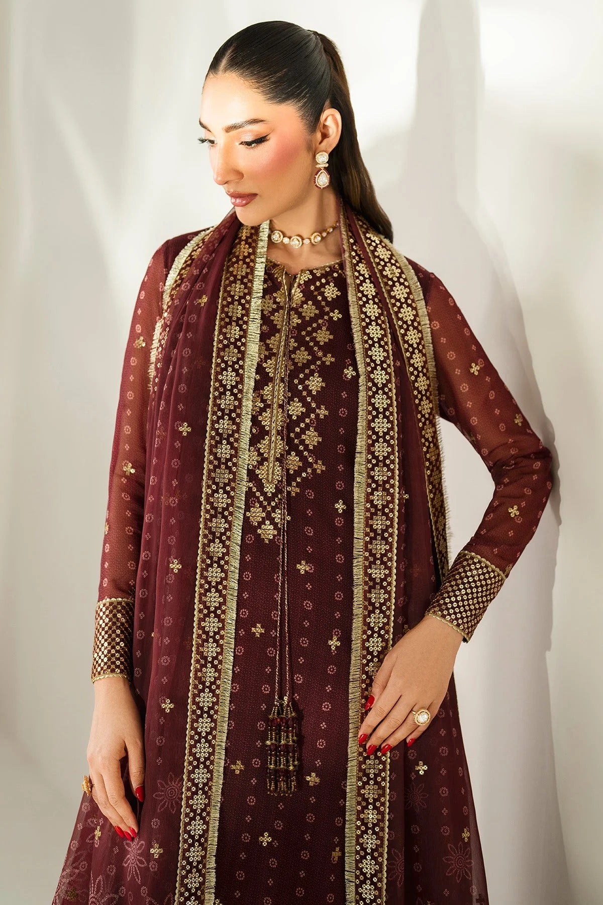 Digitally printed chiffon with intricate embroidery, bordered dupatta, and dyed raw silk bottom—perfect for weddings, festive events, or formal wear.