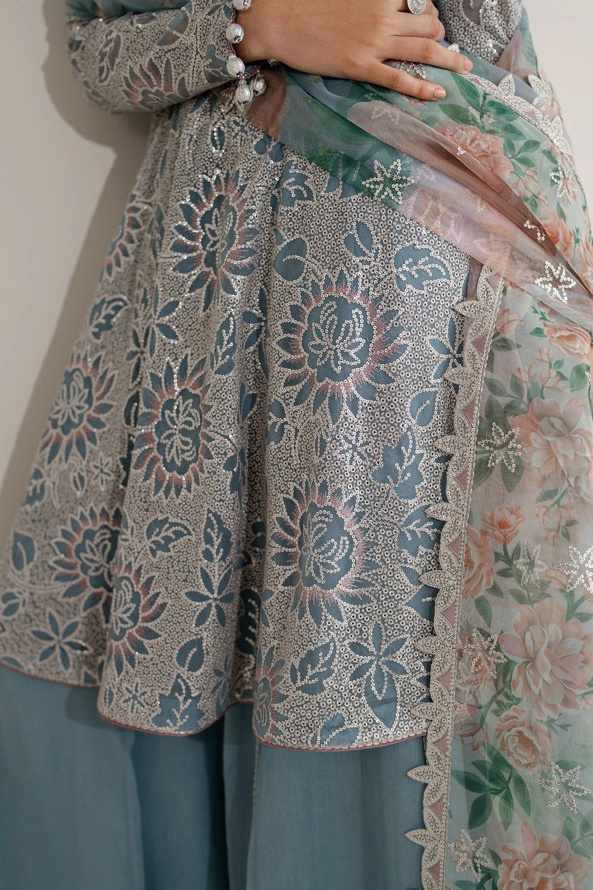 Featuring embroidered chiffon, organza dupatta, and rawsilk bottom, UC-3075 blends tradition and style—perfect for formal events and festive wear.